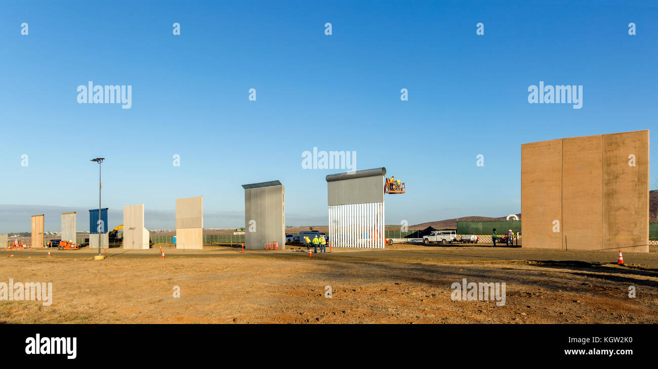 Trump administration new US-Mexico border wall prototypes are unveiled in October 2017. Eight different prototype sections of wall all 30 feet high (9 metres), the maximum height specified by the tender, and made of a mixture of concrete and metal are erected near the Otay Mesa Port of Entry in California. The designs will be subjected to testing to ensure they can withstand attack and attempts to go through, under and over them. See more information below. Stock Photo