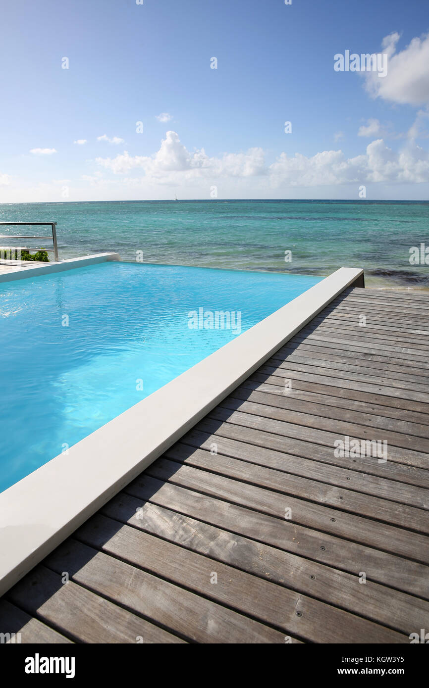 Beautiful view of infinity pool with wooden deck Stock Photo