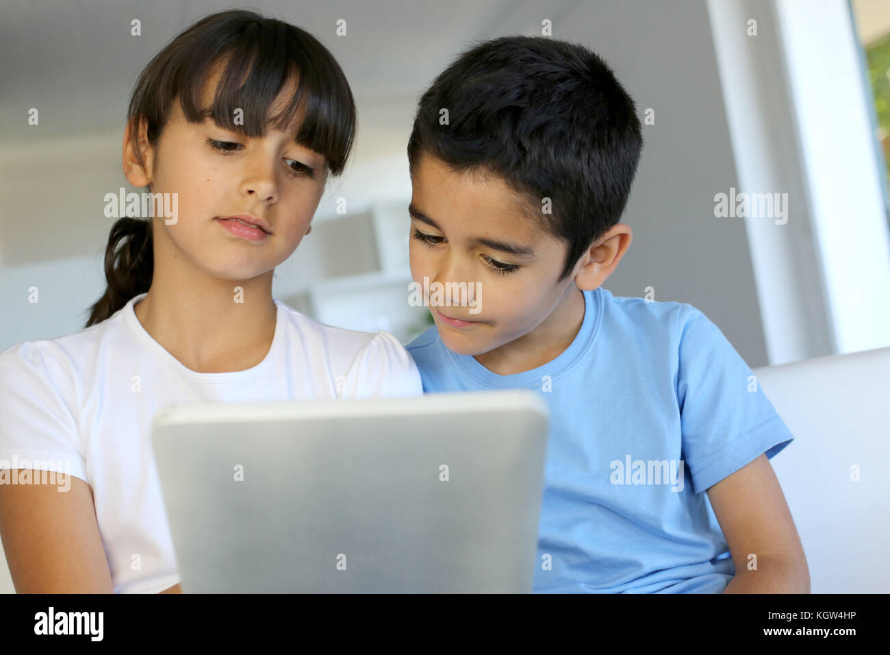 Children Playing With Electronic Tablet At Home Stock Photo Alamy children-playing-with-electronic-tablet-at-home-stock-photo-alamy