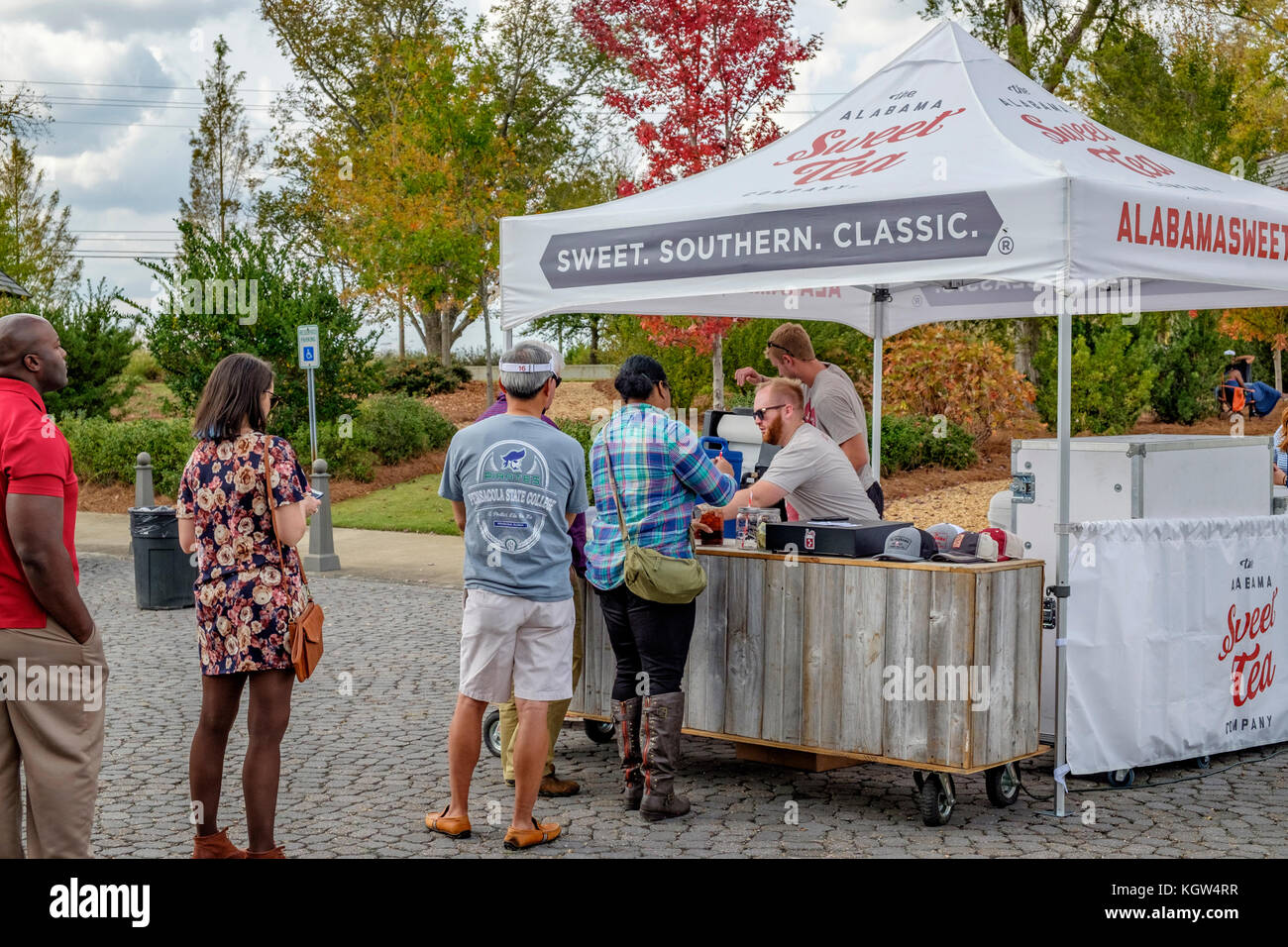 Customers at a food truck festival in a small community in Montgomery Alabama, USA, wait in line, or queue, to order food. Stock Photo
