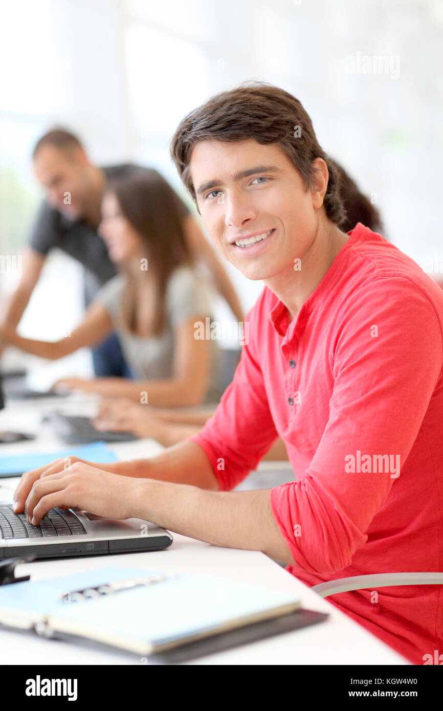 Student in class using laptop computer Stock Photo - Alamy