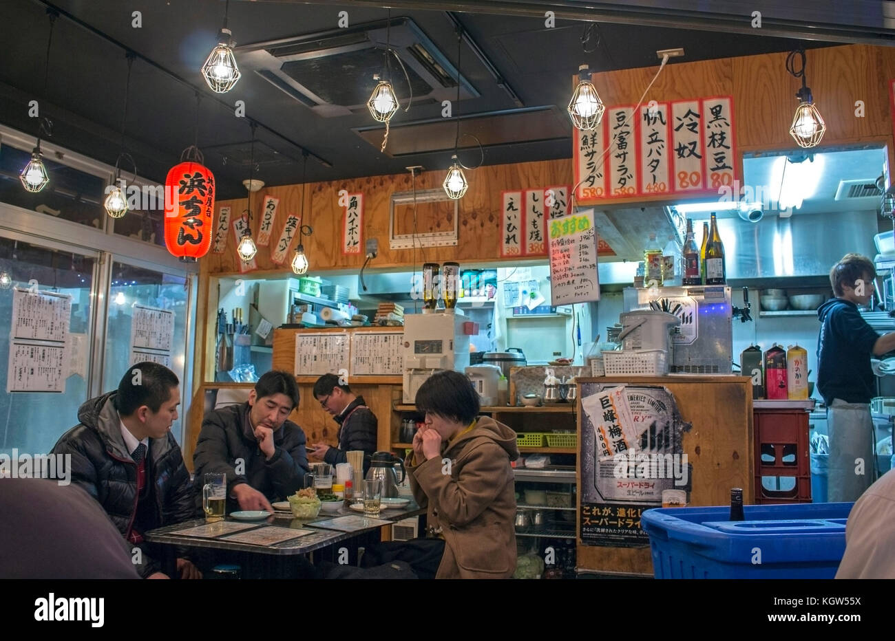August 11th, 2017 - Tokyo, Japan. People casually gathered at a Japanese restaurant, Izakaya, eating and drinking with friends after work in Ueno, Thi Stock Photo