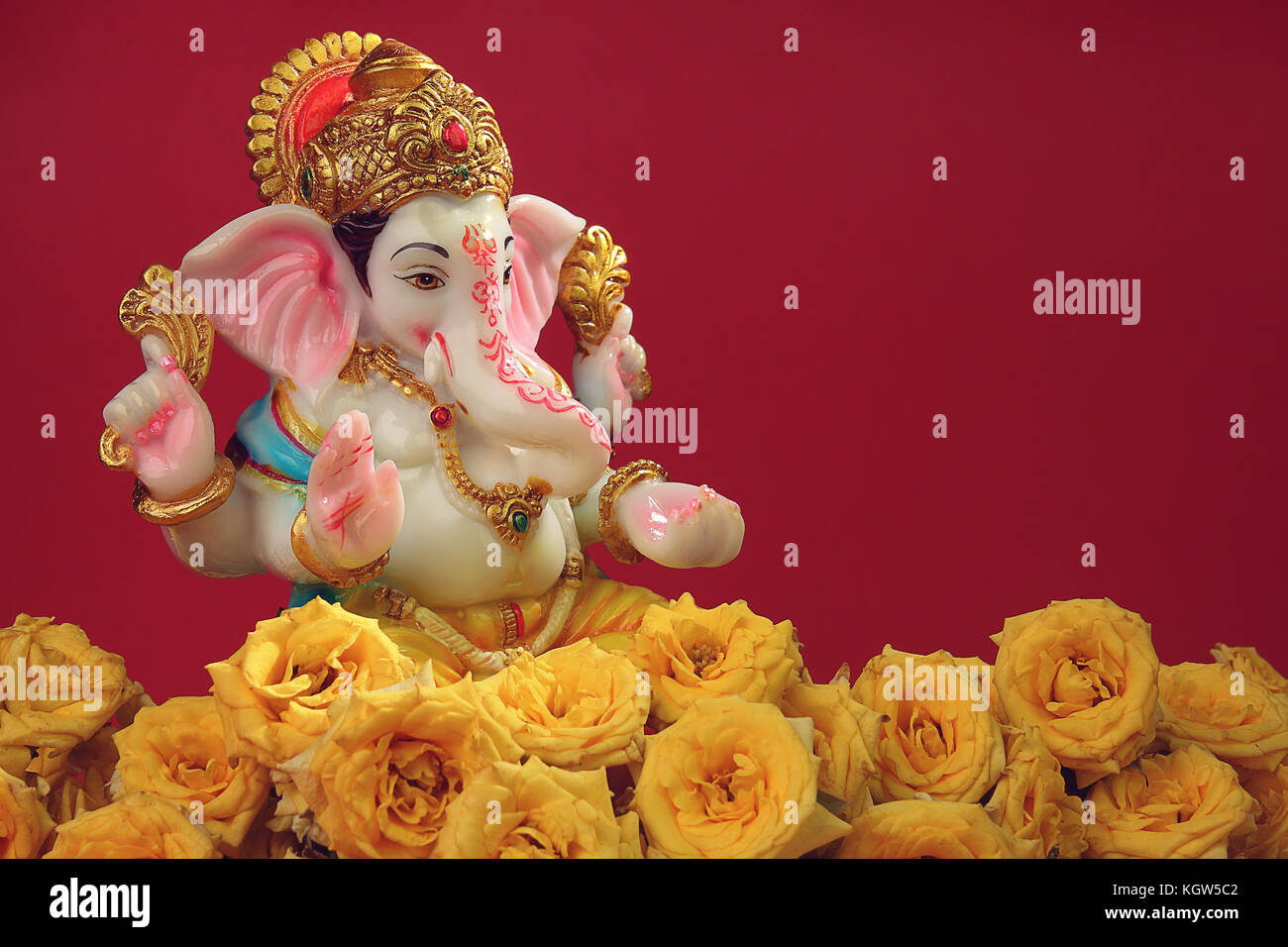 Hindu God Ganesha with Rose Flowers Stock Photo Alamy