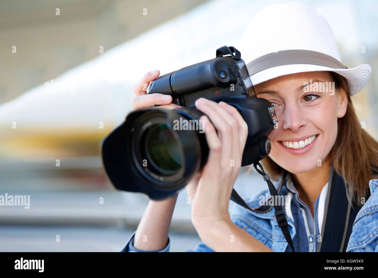 Photographer capturing photo with professional camera Stock Photo Alamy