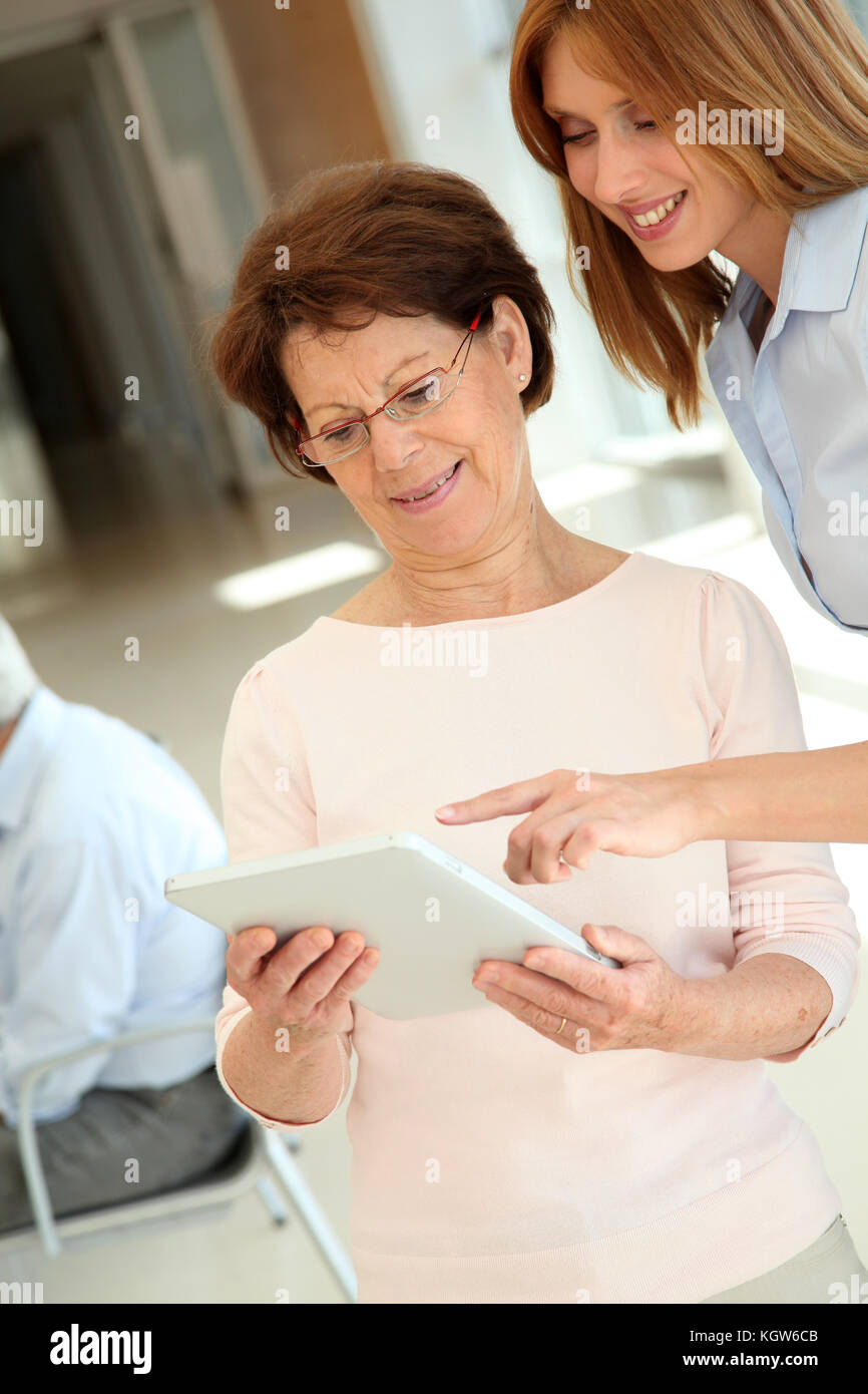Senior woman learning how to use electronic tablet Stock Photo Alamy