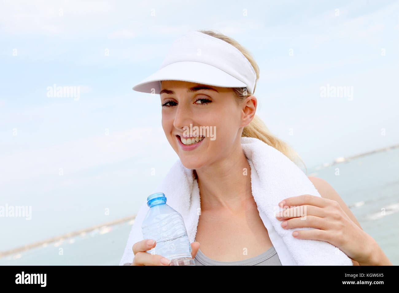 Portrait of jogger drinking water Stock Photo