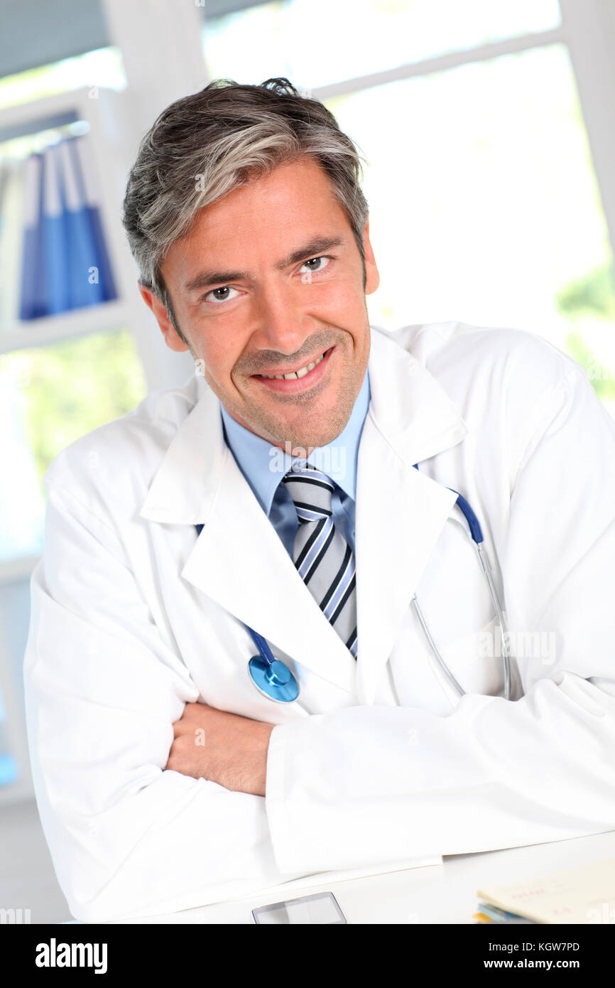 Portrait of handsome smiling doctor Stock Photo - Alamy