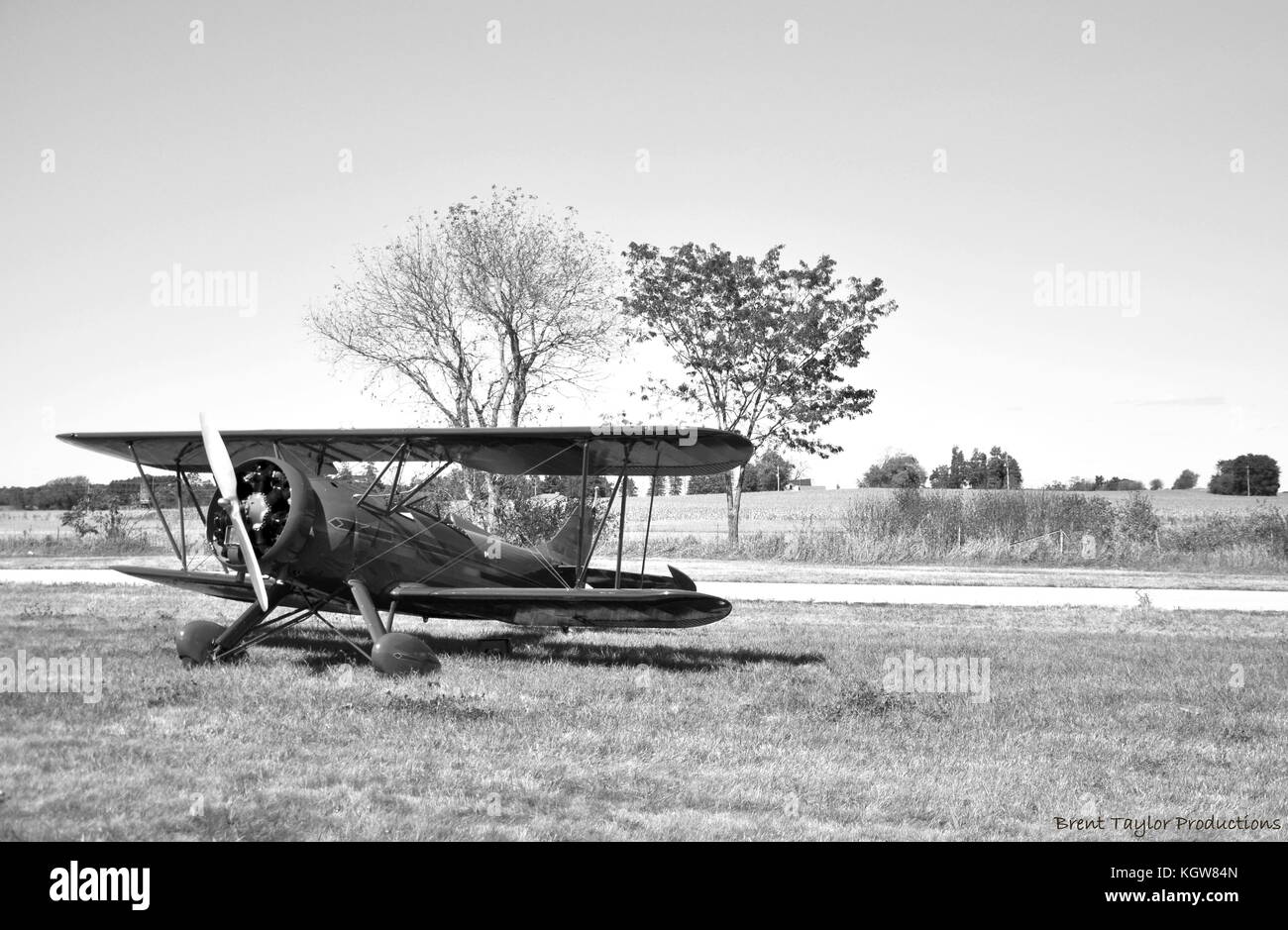 1930's open cockpit biplane at rest on a fall afternoon Stock Photo