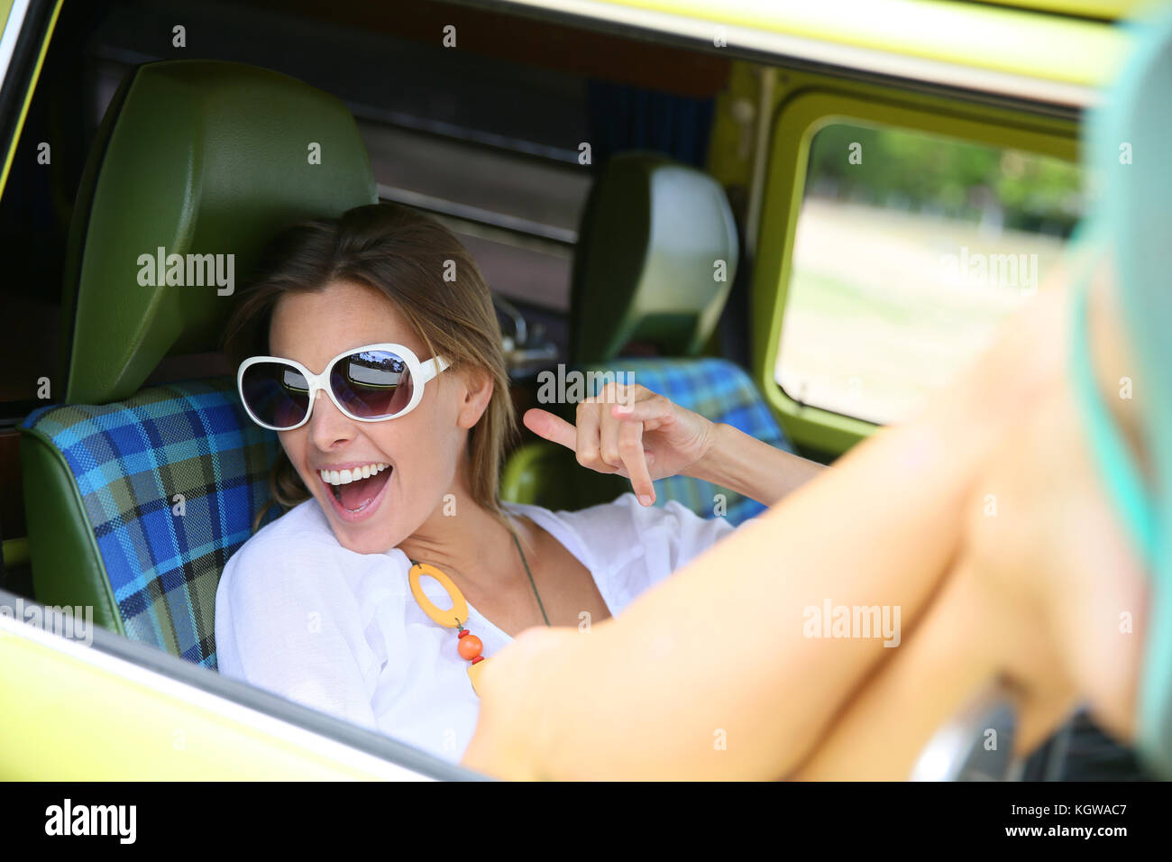 Portrait of hipster girl relaxing in camper van Stock Photo