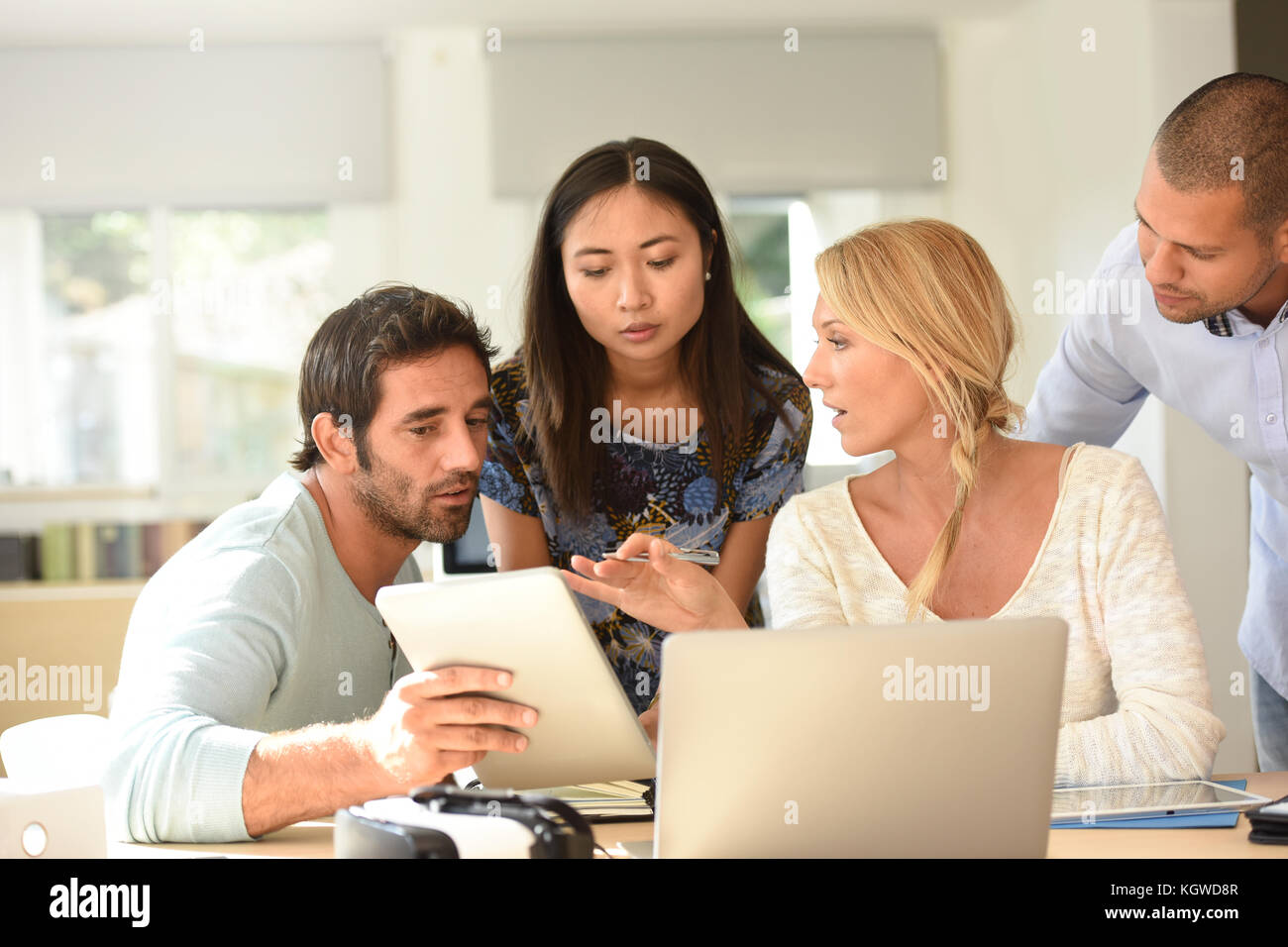 Workgroup in office meeting on project Stock Photo - Alamy