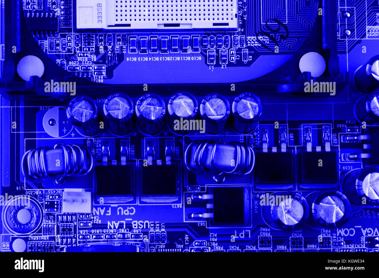 Resistors, capacitors and other electronic components of micro chip inside the computer close up