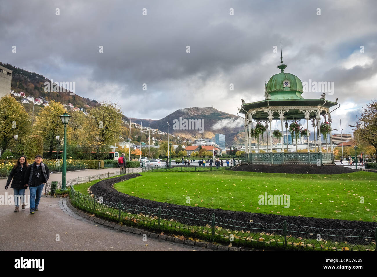 Bergen, Norway -  October 2017 : People walking on footpath near Gazebo in front of small Lille Lungegardsvannet lake in Bergen, Norway Stock Photo