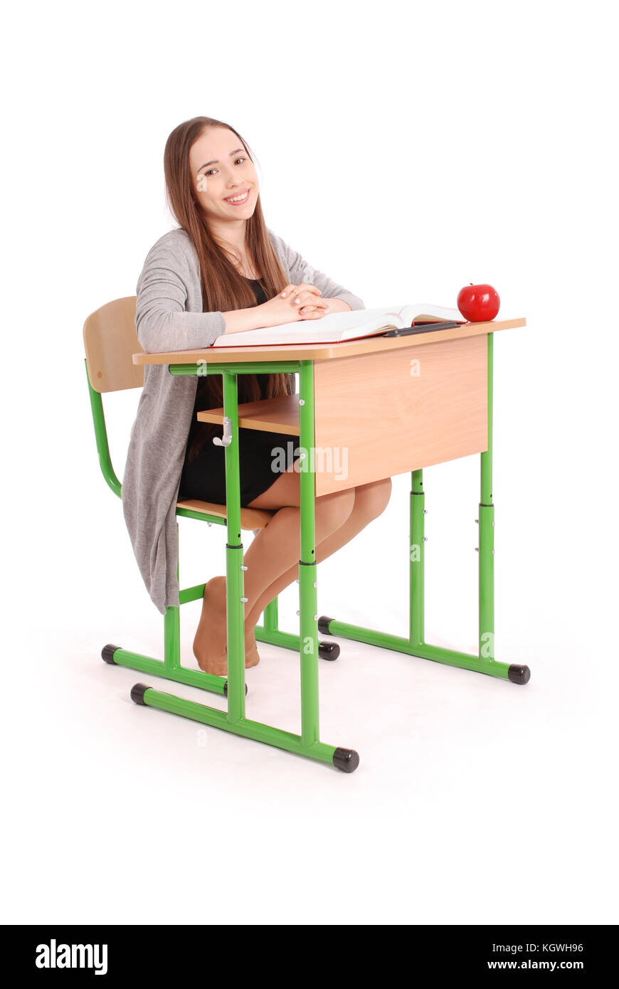 School girl sitting at a desk isolated on white Stock Photo - Alamy