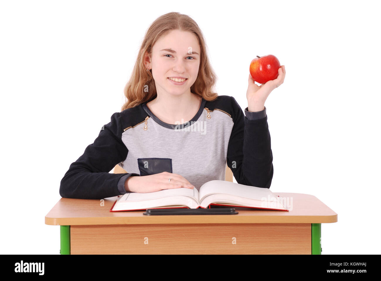 School girl sitting at a desk isolated on white Stock Photo - Alamy