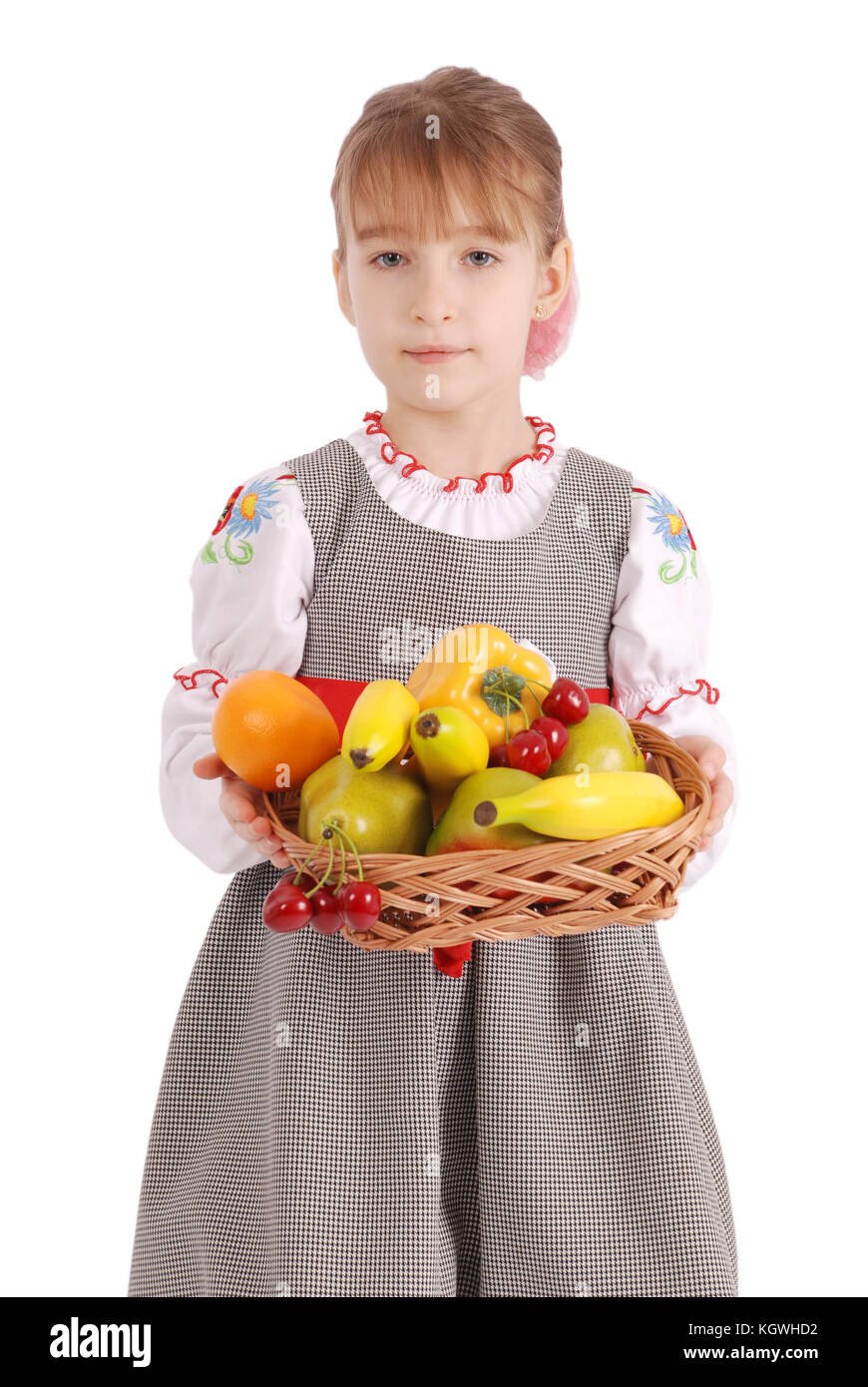 Smiling girl holding straw basket with fruits. Studio isolated Stock ...