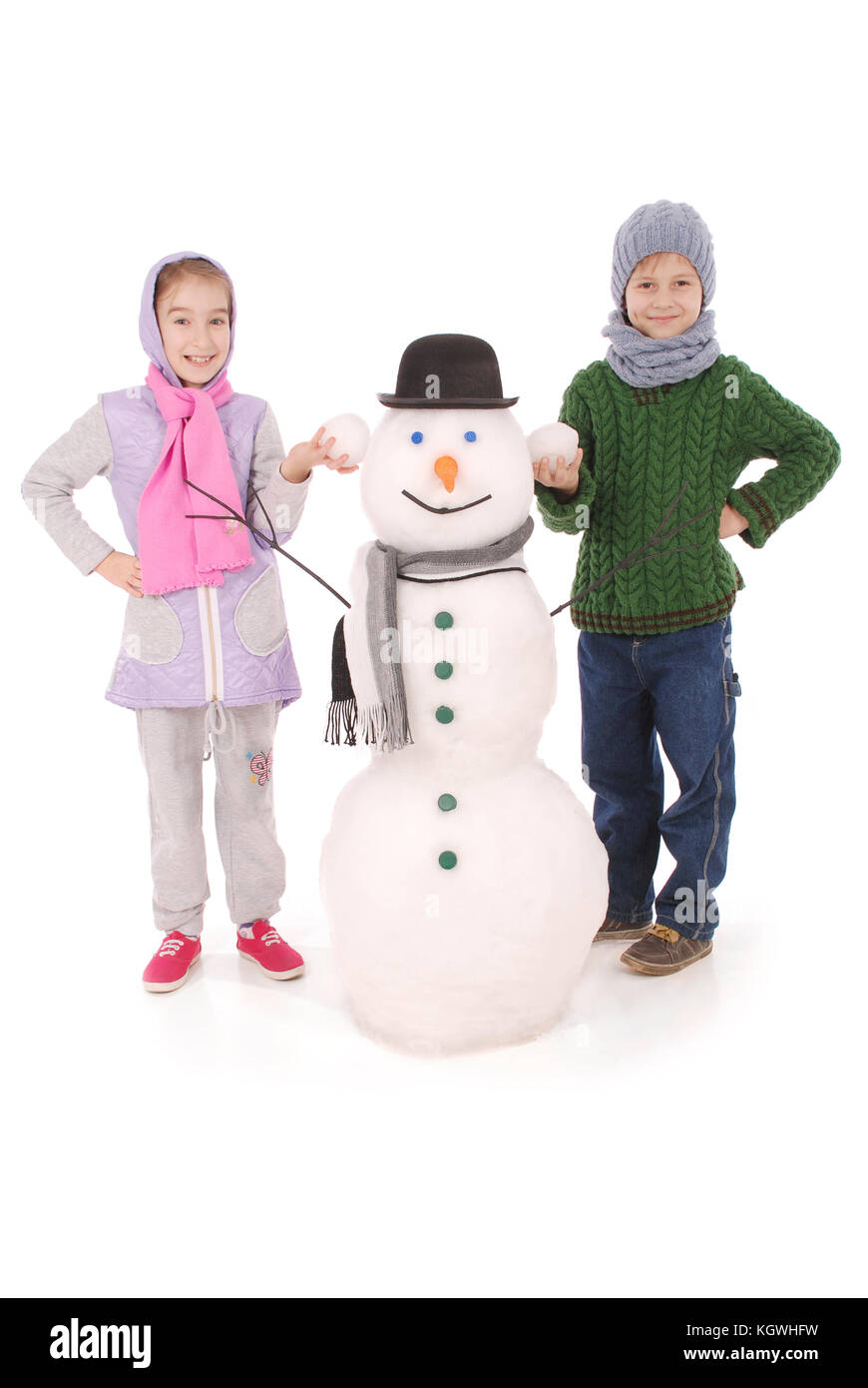 Cute boy and girl with snowman with scarf and hat on white background ...