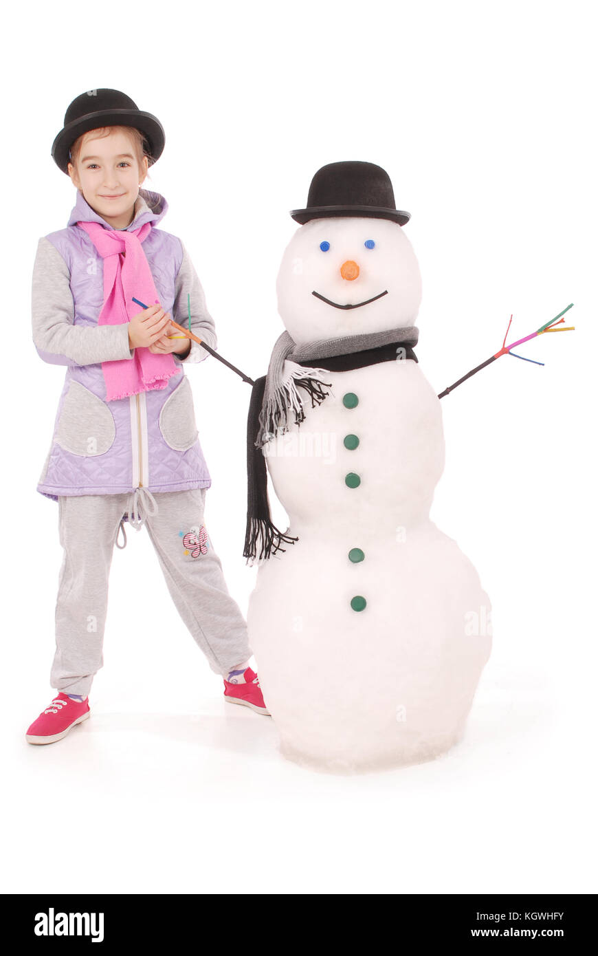 Cute girl with snowman with scarf and hat on white background Stock ...