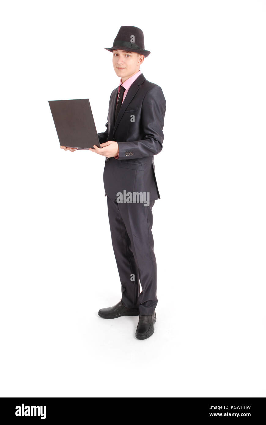 Full length portrait of confident mature businessman with a laptop in ...