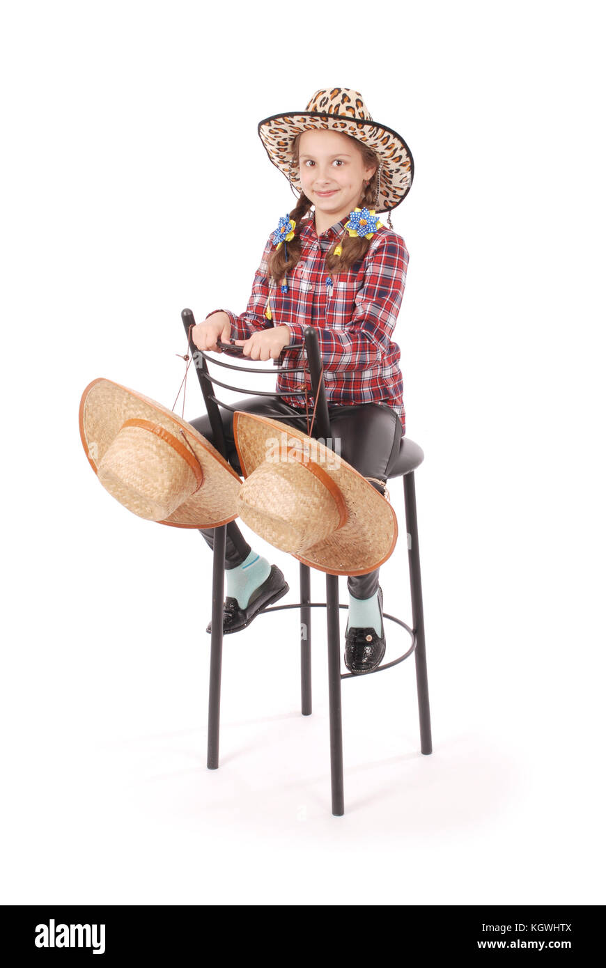 Portrait of adorable smiling little girl sitting on a chair with her ...
