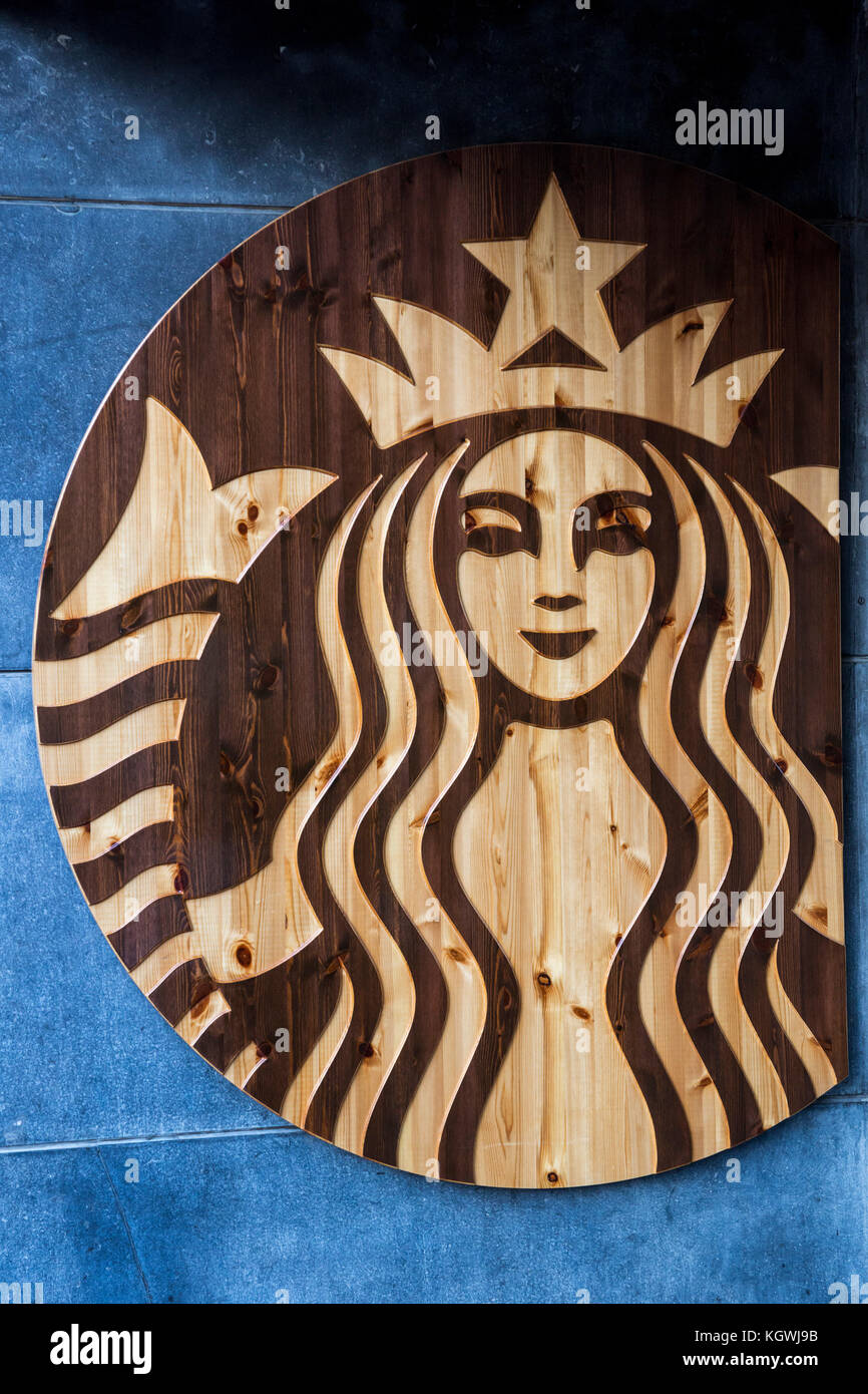 Wooden Starbucks Coffee logo in Aachen, Germany Stock Photo