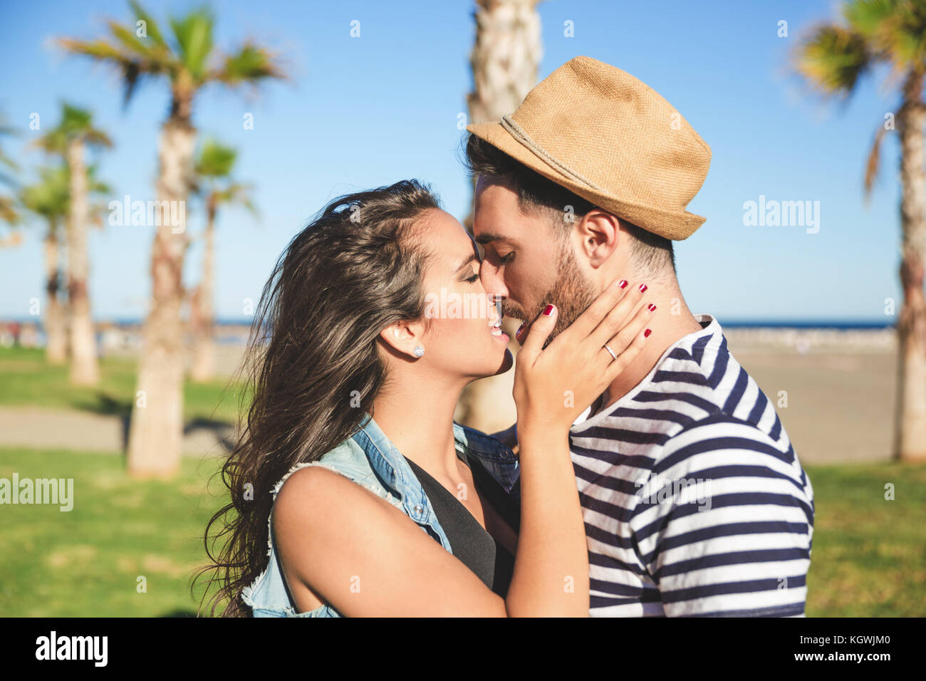 Kiss, love, romantic dating concept. Profile portrait of young