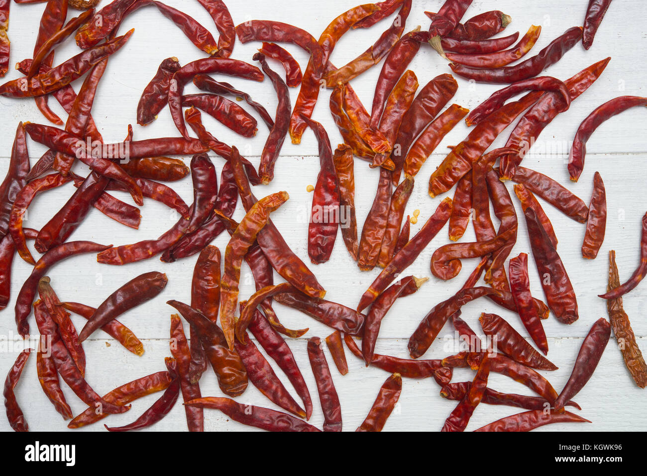 red hot chili peppers on a wooden background Stock Photo - Alamy