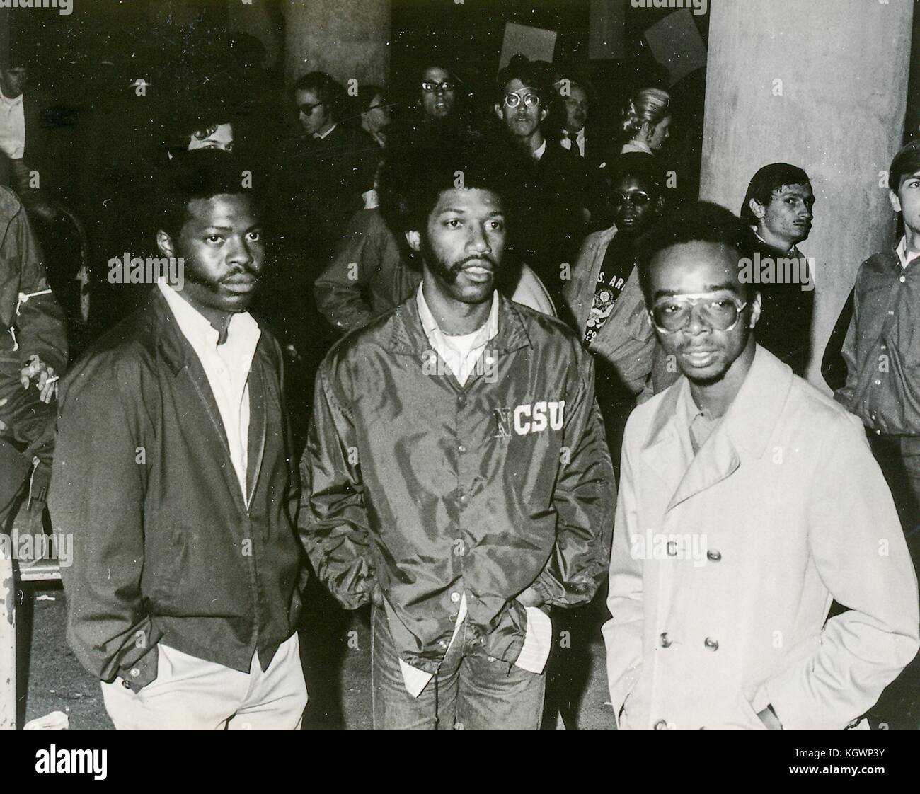 Three African American Students With Afro Haircuts Stand