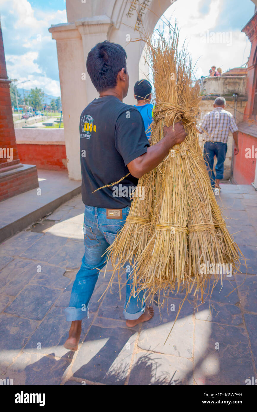 KATHMANDU, NEPAL OCTOBER 15, 2017: Unidentified man carrying in his ...
