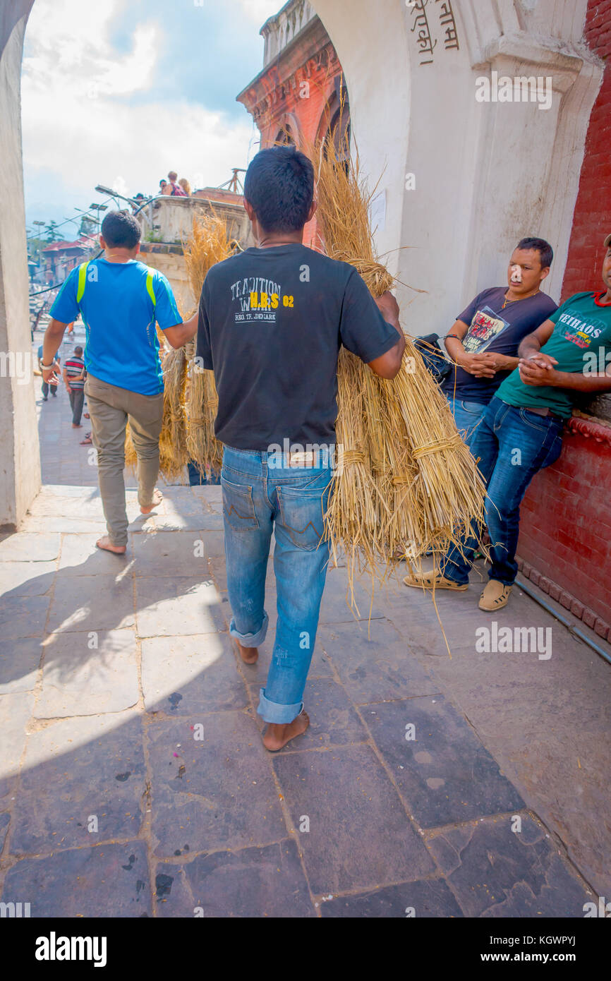 KATHMANDU, NEPAL OCTOBER 15, 2017: Unidentified man carrying in his ...