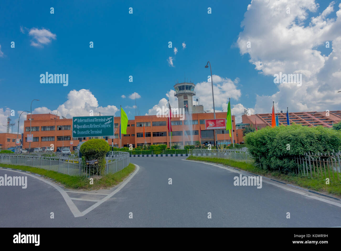 Kathmandu, Nepal - October 25th, 2016: Big building of Tribhuvan International Airport in a beautiful blue sky in Kathmandu Nepal. Only exist one international airport in Nepal Stock Photo