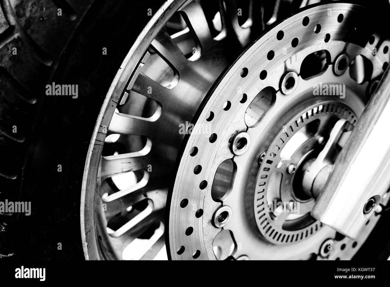 Isolated motorcycle front wheel in black and white / Close up view of motorcycle front wheel Stock Photo