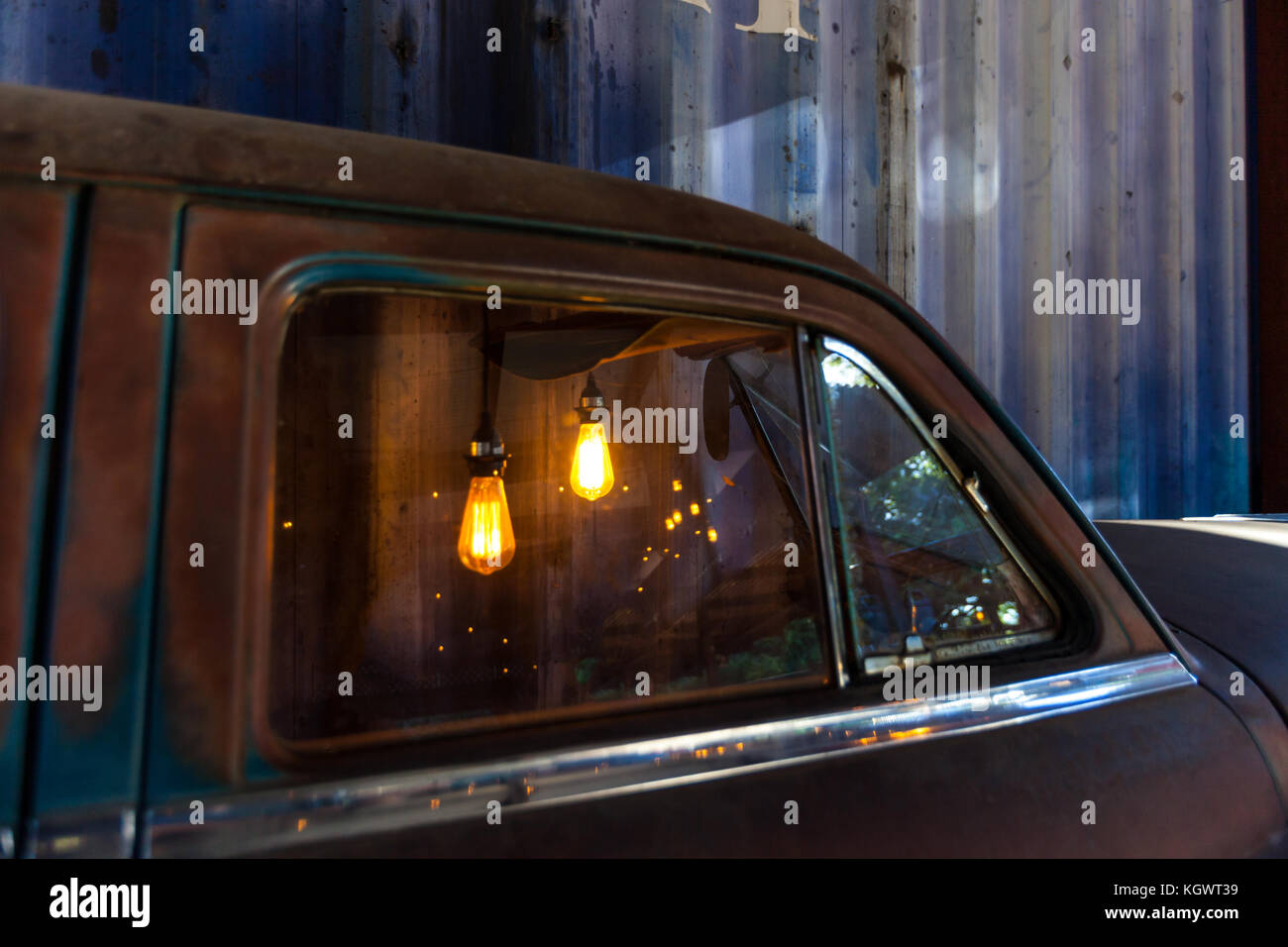 Edison Light bulbs in a vintage rusty car used as decoration/ Sectioned