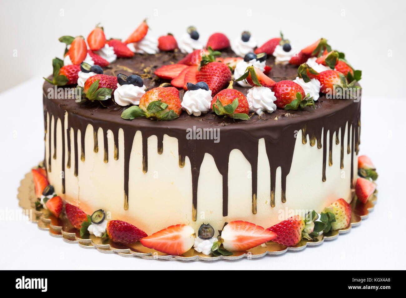 strawberry birthday cake on white background Stock Photo - Alamy