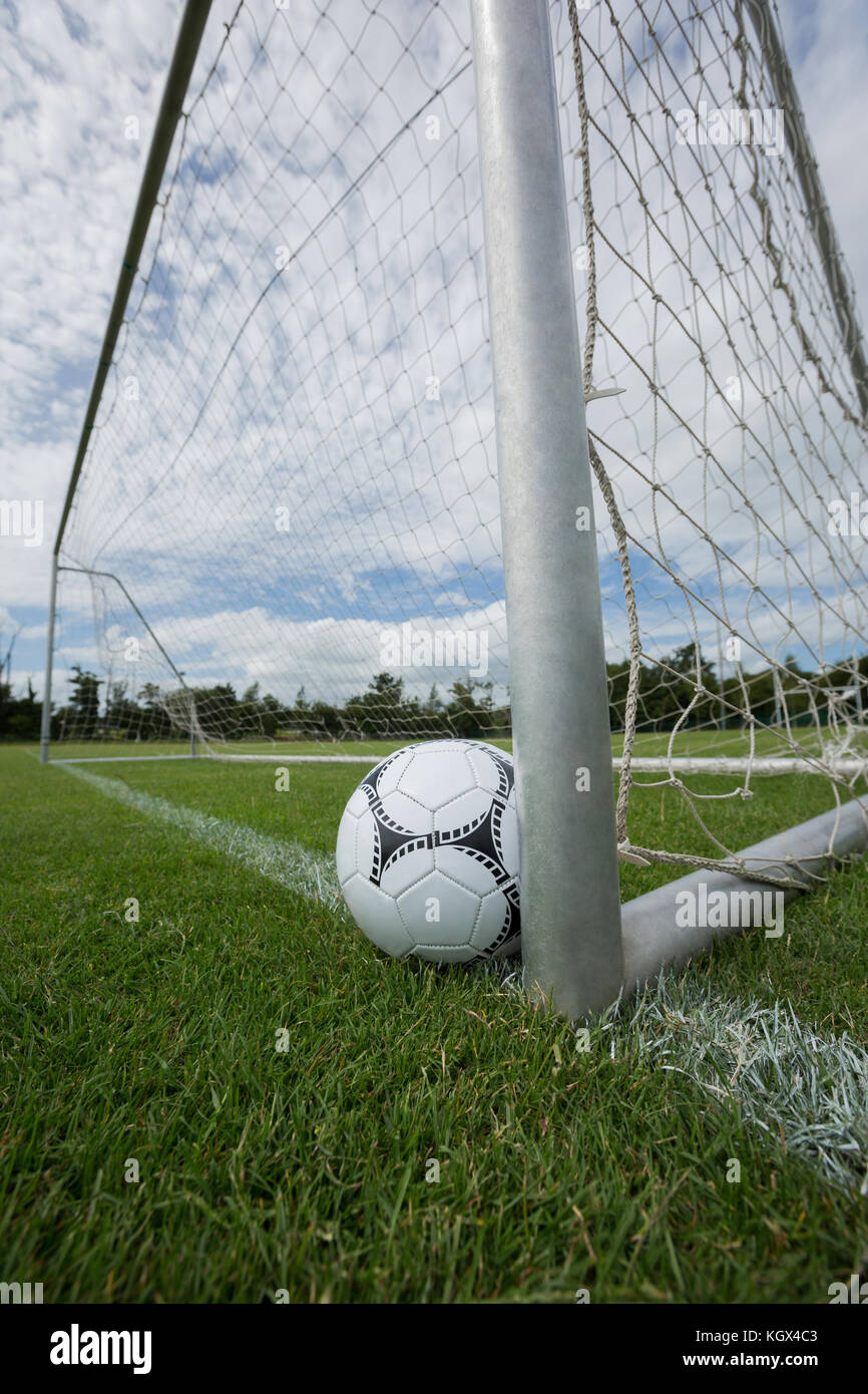 Soccer ball near a goal post in football stadium Stock Photo Alamy