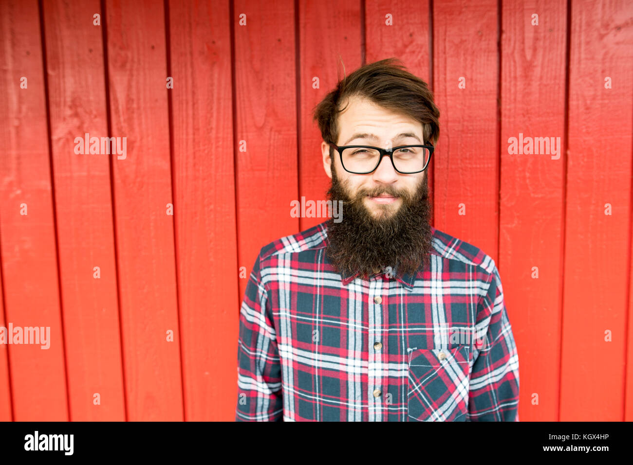 hipster man with beard red background Stock Photo