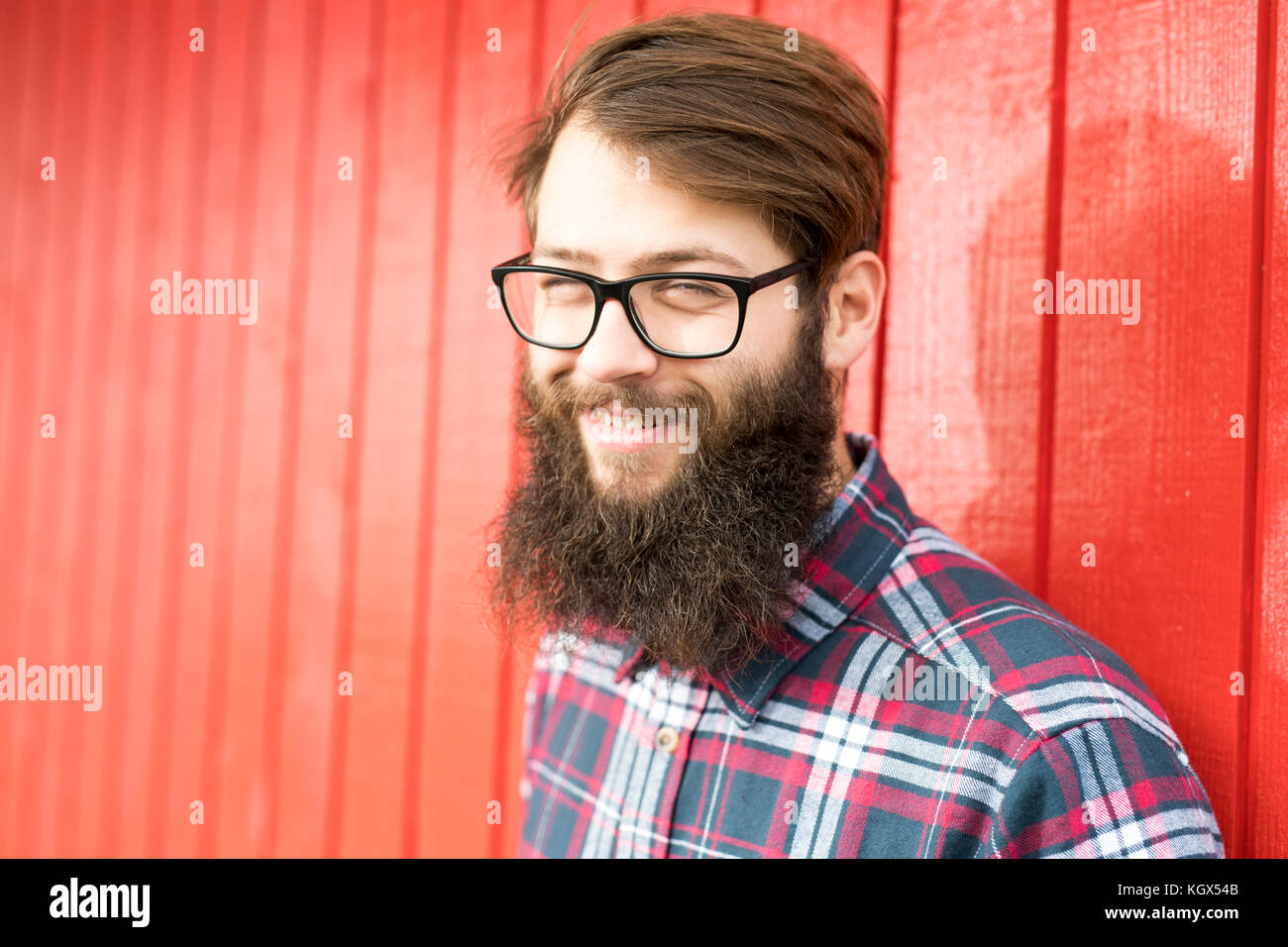hipster man with beard red background Stock Photo