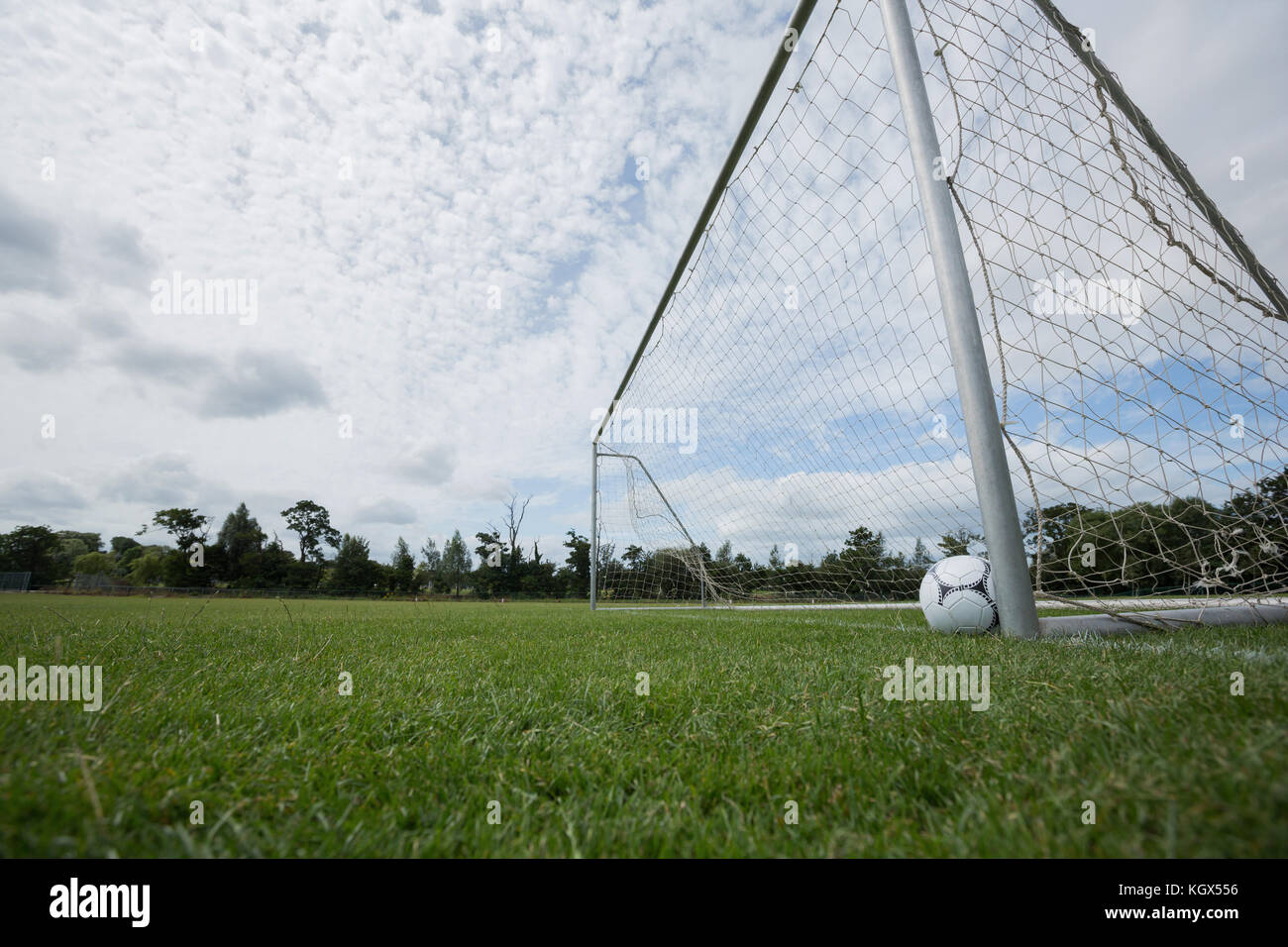 Soccer ball near a goal post in football stadium Stock Photo Alamy