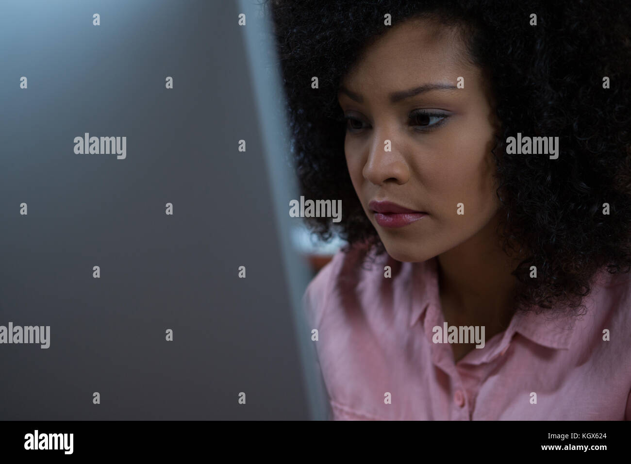 Young woman using computer at home Stock Photo - Alamy