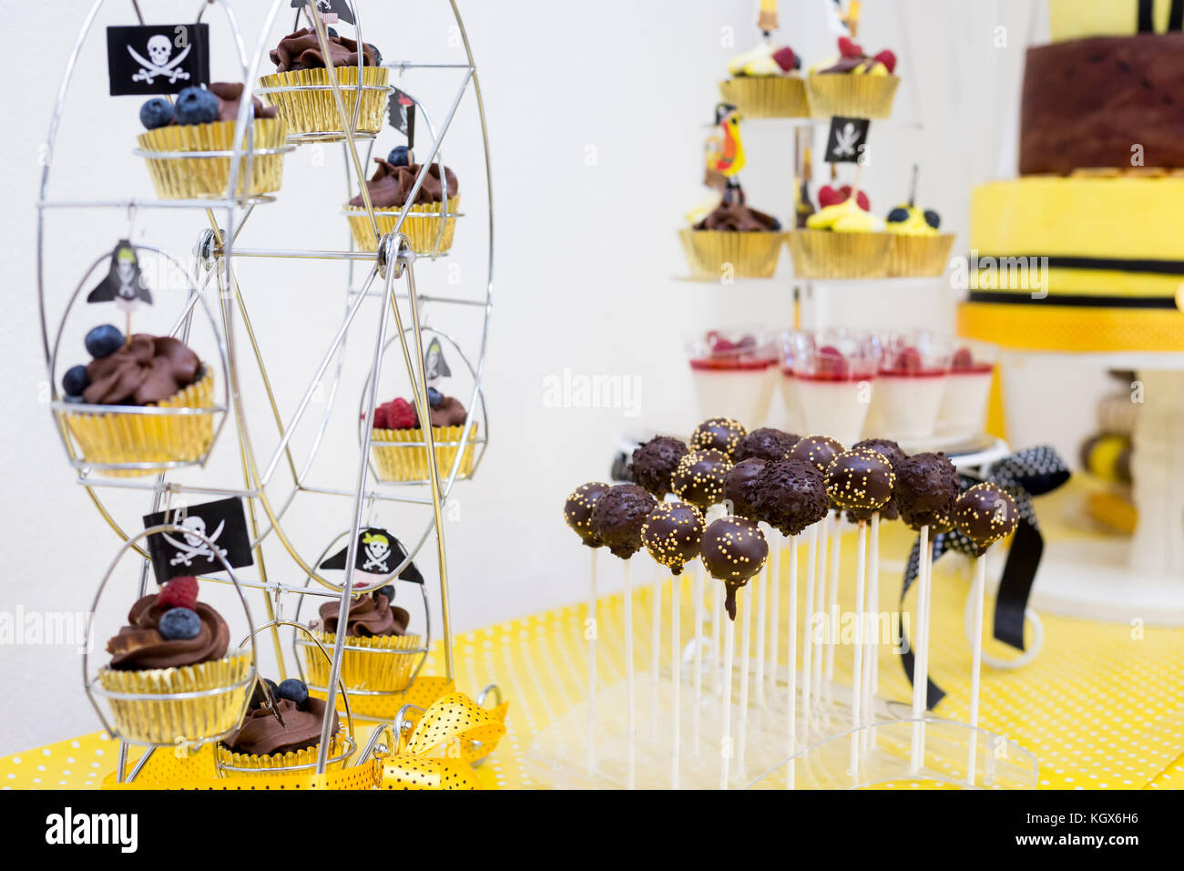 Assortment Of Birthday Party Cakes In Yellow And Black Color