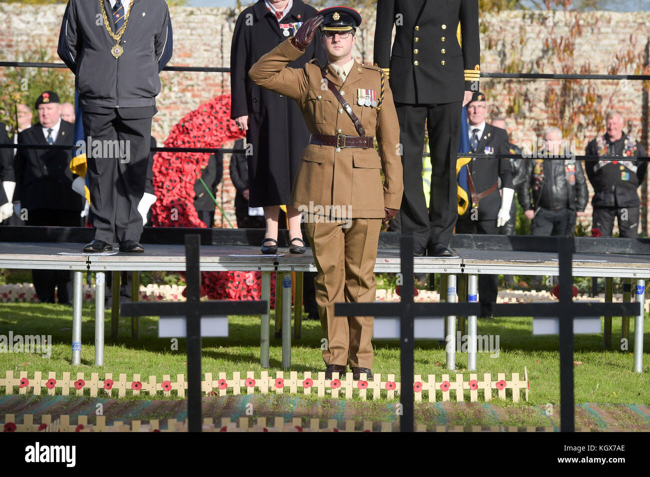 A member of the British Army salutes after planting a cross in the Royal Wootton Bassett Field of Remembrance at Lydiard park, Swindon, as it opens to honour and remember those who have been lost serving in the Armed Forces. Stock Photo