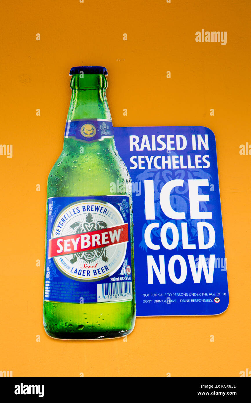 Sey480The Seychelles, La Digue, La Passe, Seybrew, locally brewed beer advertisement on shop front Stock Photo