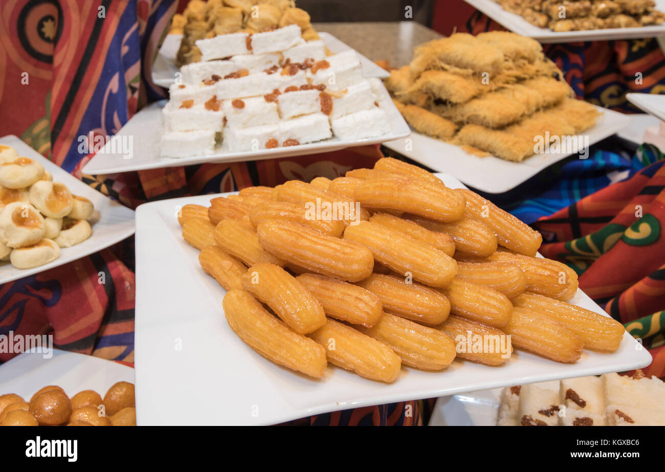 Selection display of sweet oriental pastry food with sham mussels at a  luxury restaurant buffet bar area Stock Photo - Alamy