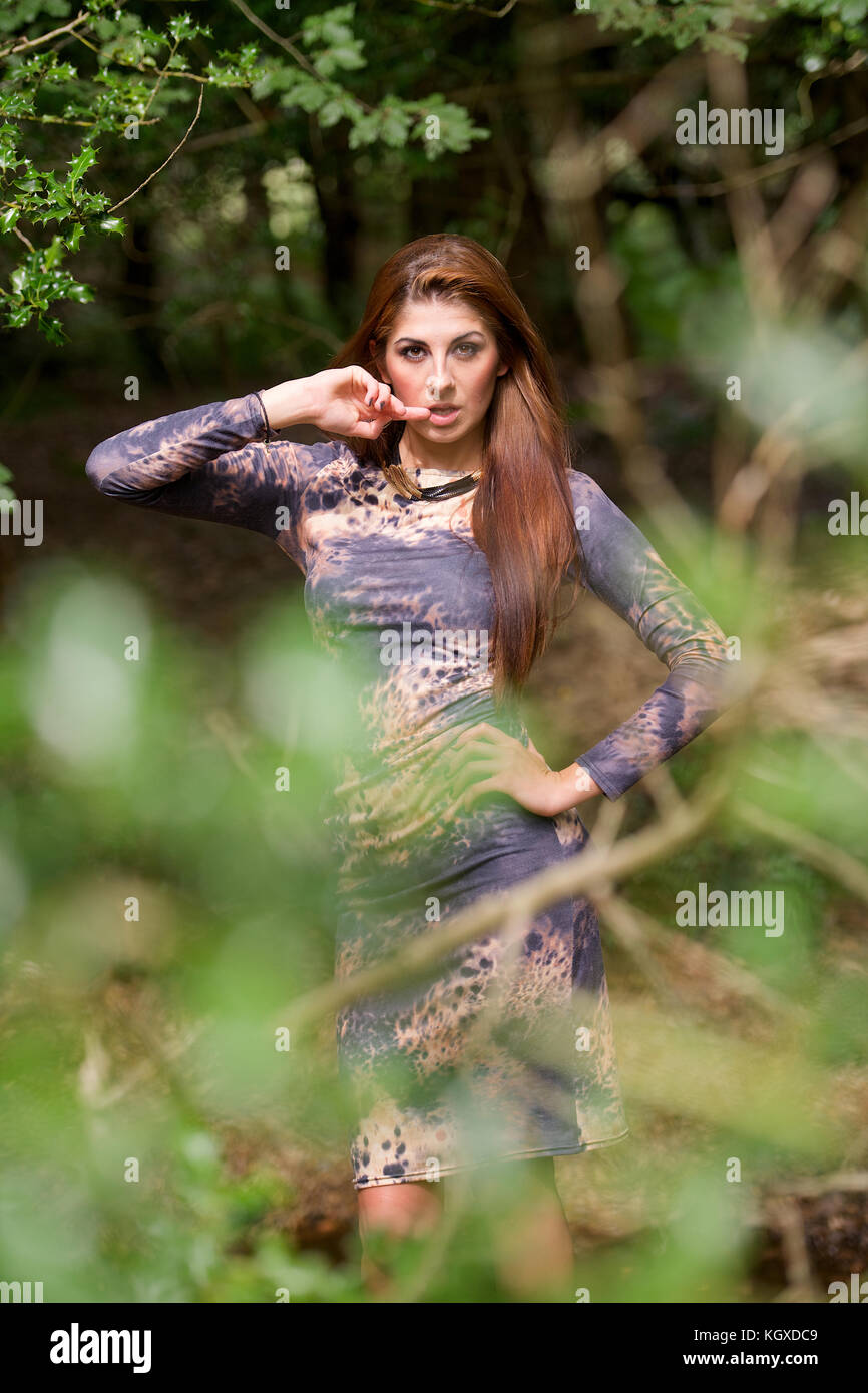 Beautiful girl wearing a dress - in a forest location Stock Photo - Alamy