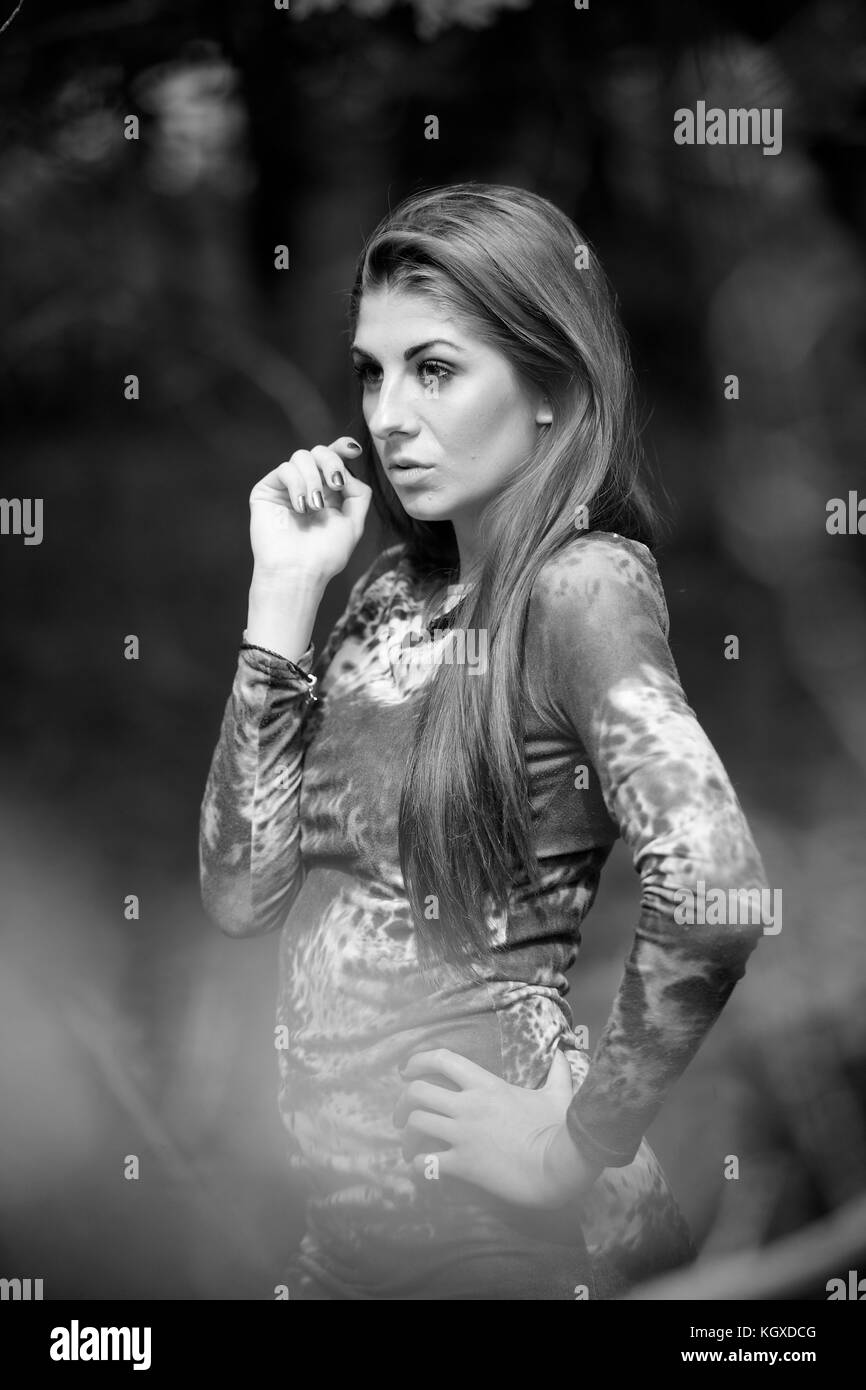 Beautiful girl wearing a dress - in a forest location Stock Photo - Alamy