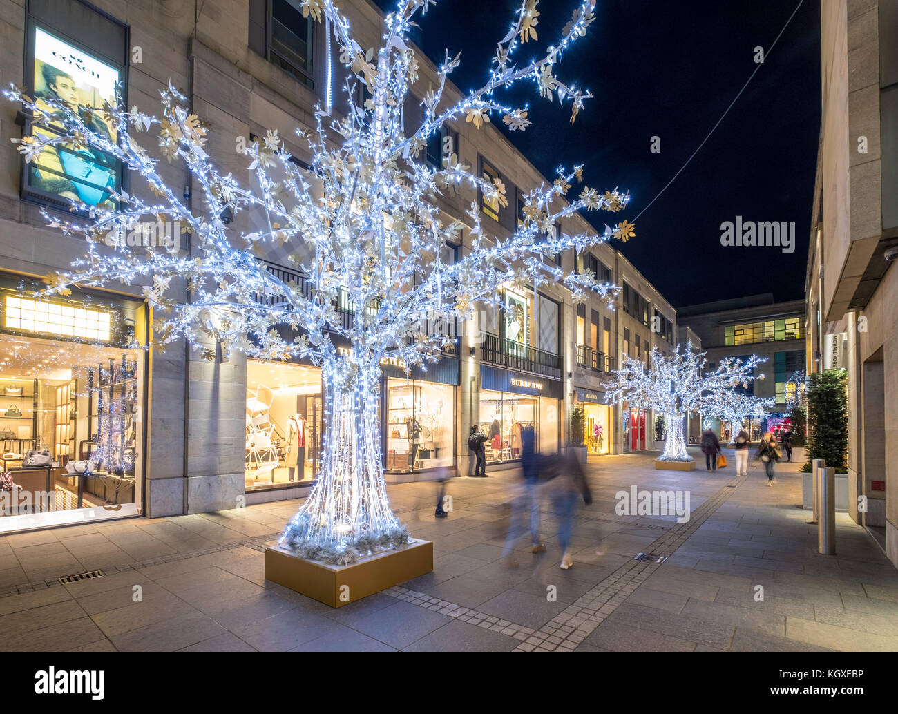 Night view of Multrees Walk upmarket shopping street with Christmas lights in off St Andrews Square in Edinburgh , Scotland, United Kingdom. Stock Photo