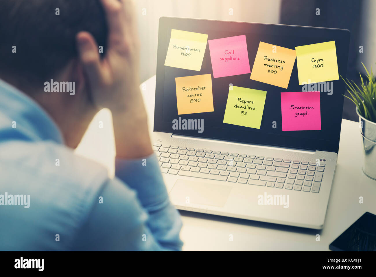 busy businessman under stress due to excessive work in office Stock Photo