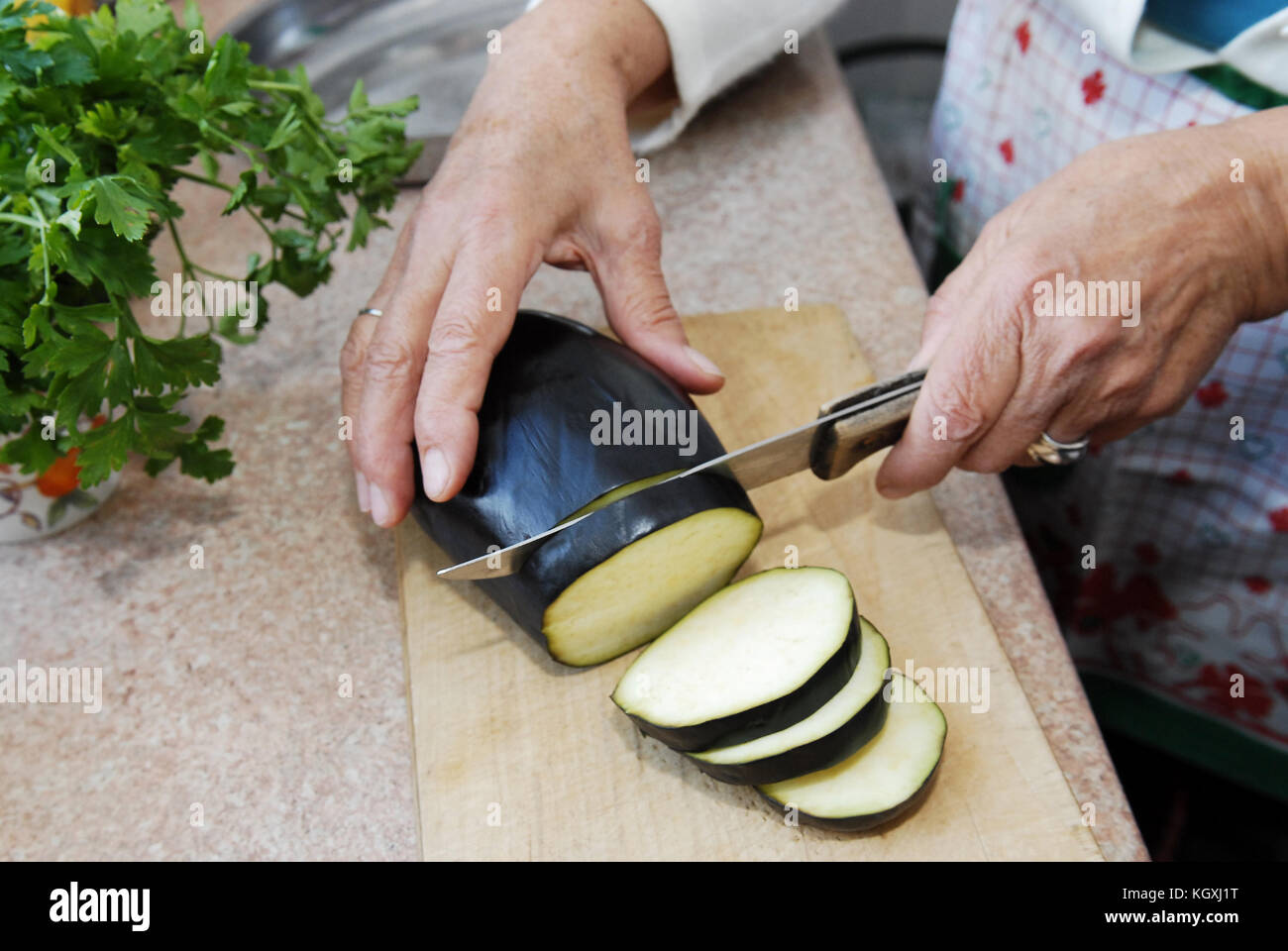 Eggplant slicing detail Stock Photo Alamy