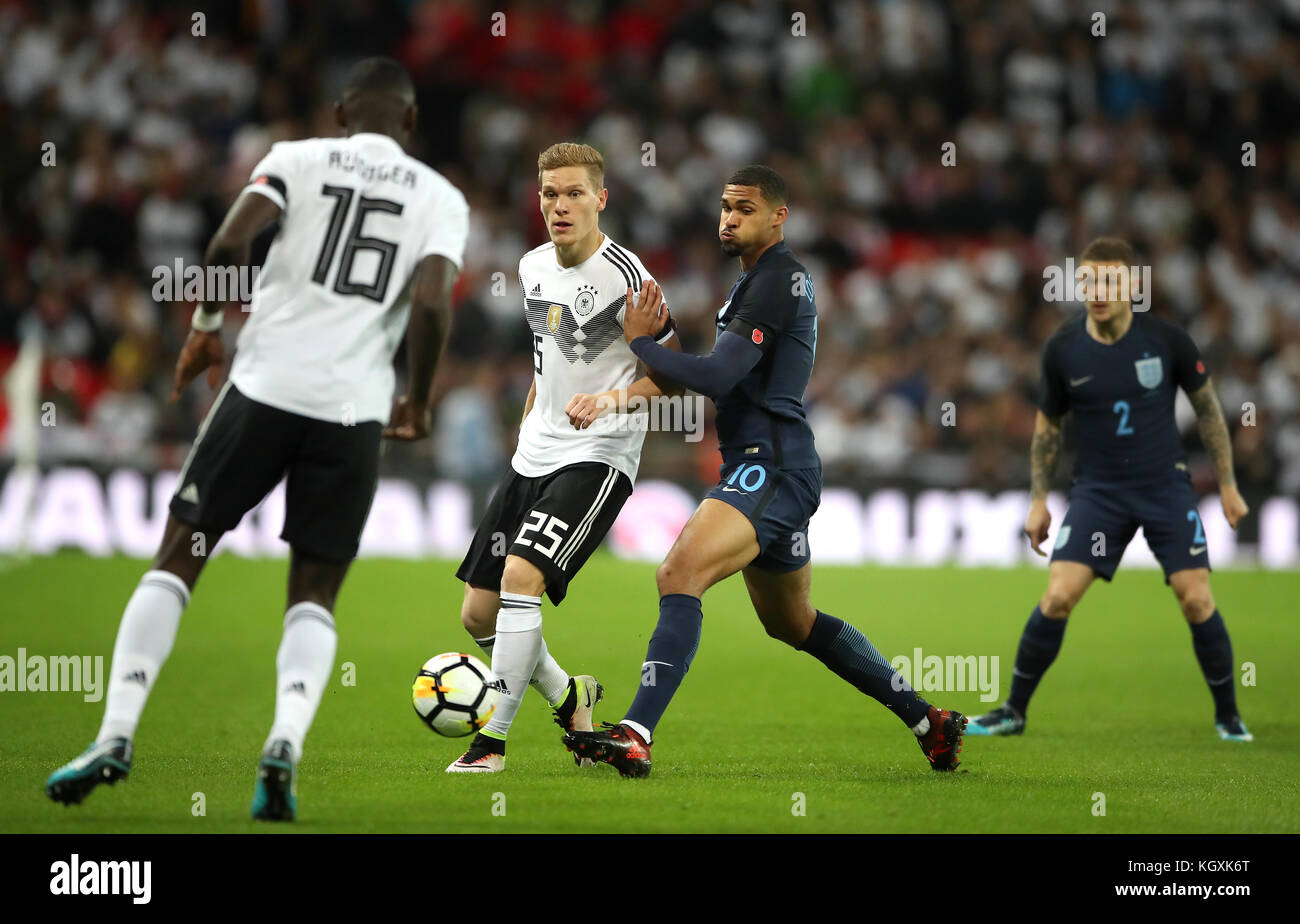 Germany's Marcel Halstenberg (left) and England's Jesse Lingard (right) battle for the ball during the International Friendly match at Wembley Stadium, London. Stock Photo