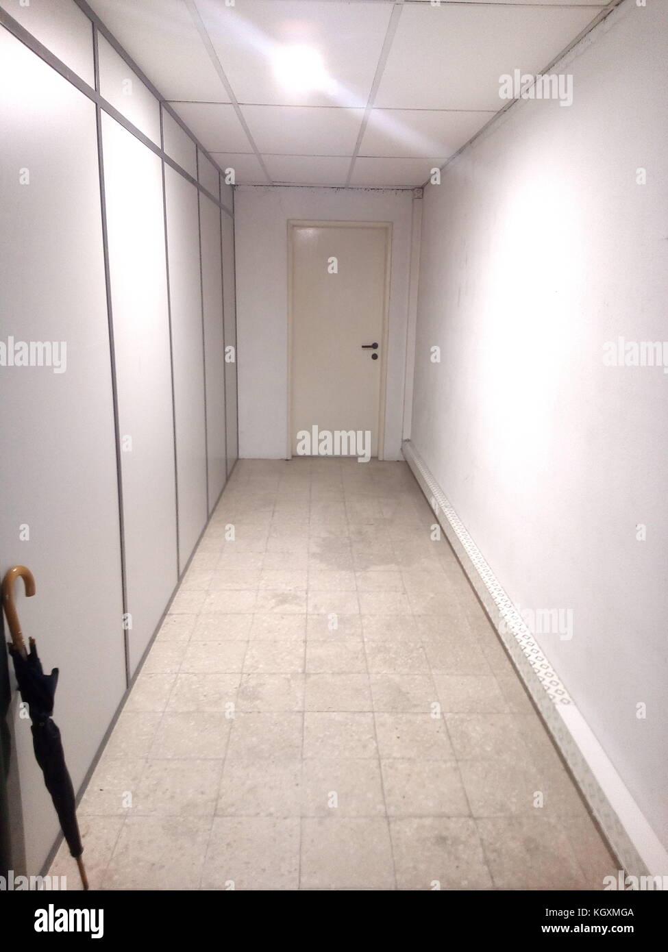 Door at end of corridor Stock Photo Alamy