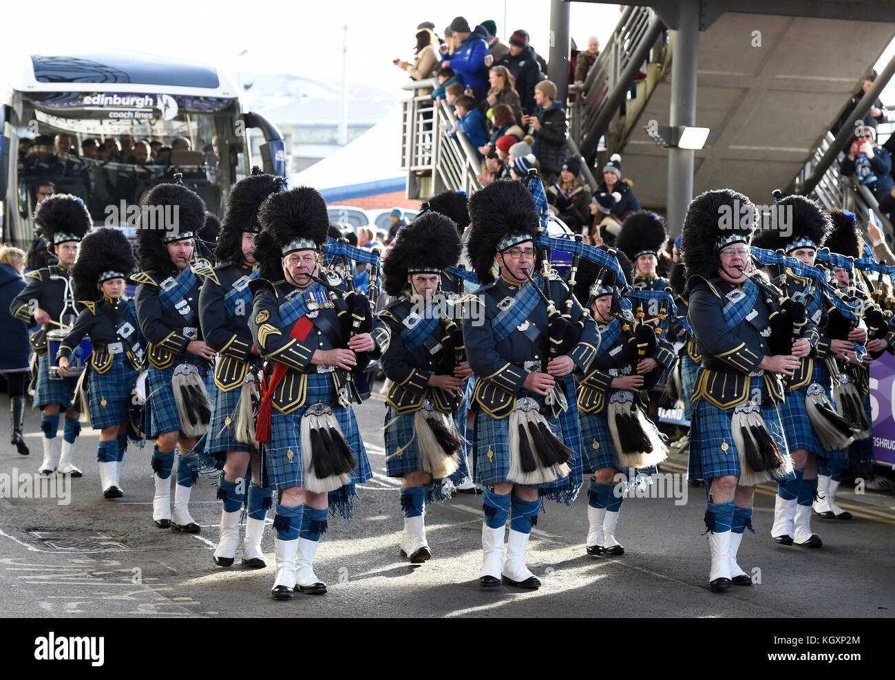 The RAF Central Scotland Pipe Band lead in the Scotland team bus prior to the Autumn International at BT Murrayfield, Edinburgh. Stock Photo